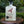 Load image into Gallery viewer, Bottle of Beeble Vespa Morta British Honey Vodka on a wooden surface with a green leafy background