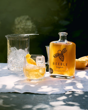 Beeble Honey Whisky Old Fashioned cocktail in a rocks glass with orange peel